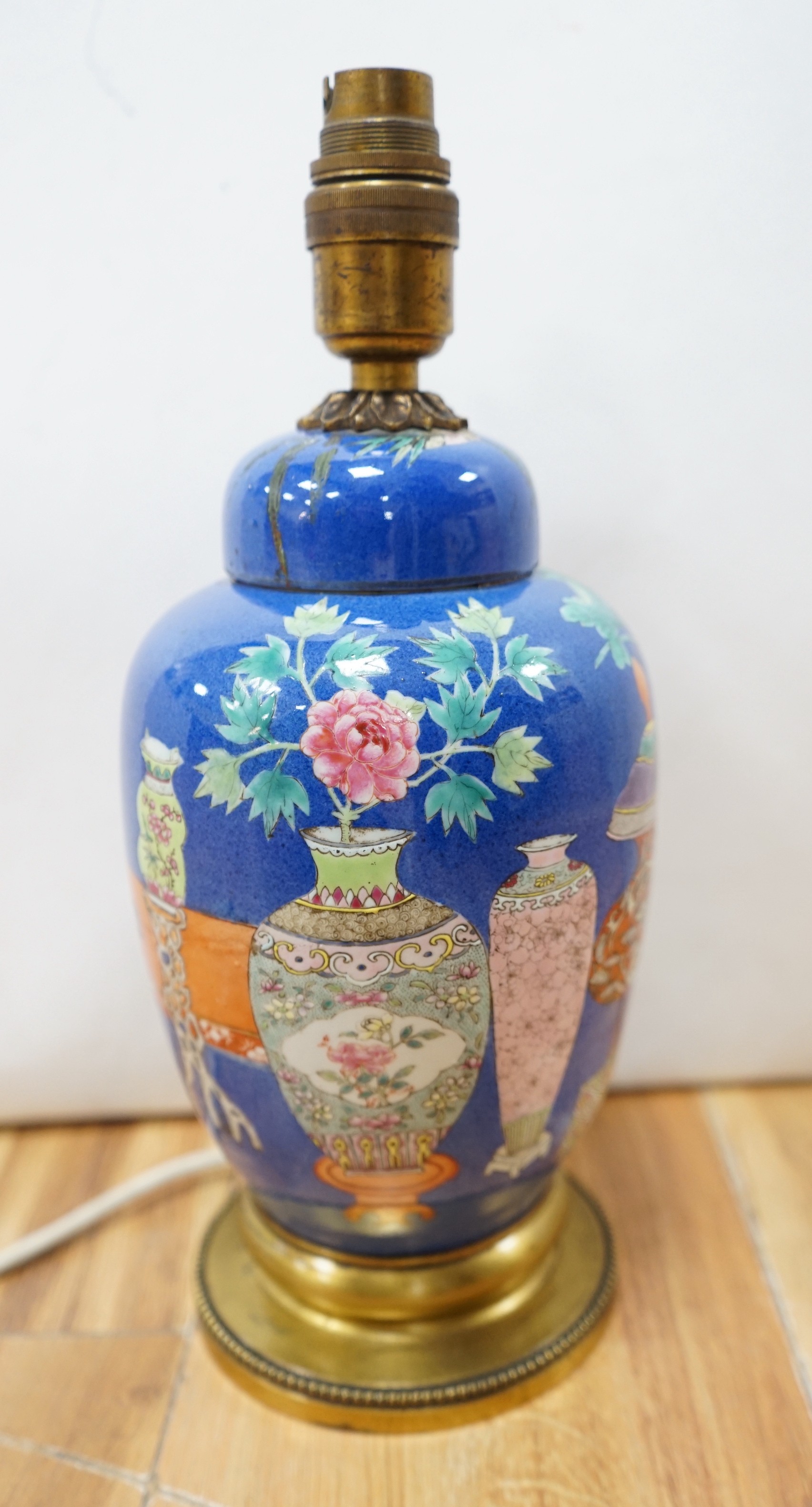 A late 19th century Chinese jar and cover with blue background and fine enamelled vases, jars, etc., later converted into a table lamp (cover broken in half and late glued to jar)